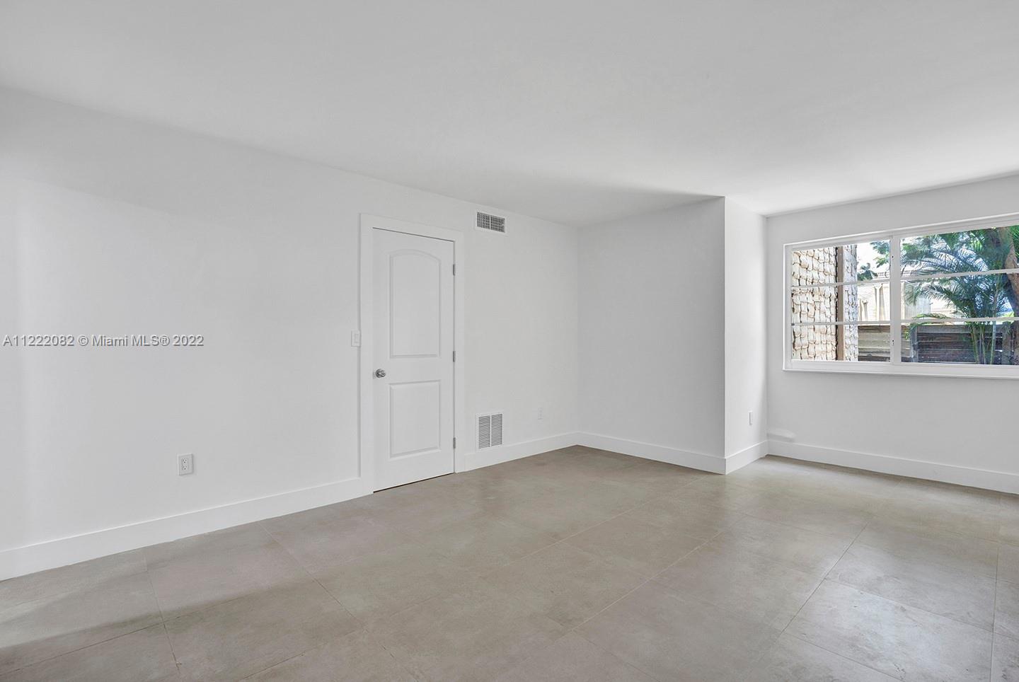 6904 North Kendall Drive, Unit F102 Pinecrest, FL 33156 - Photo 13 of 19 an empty room with windows