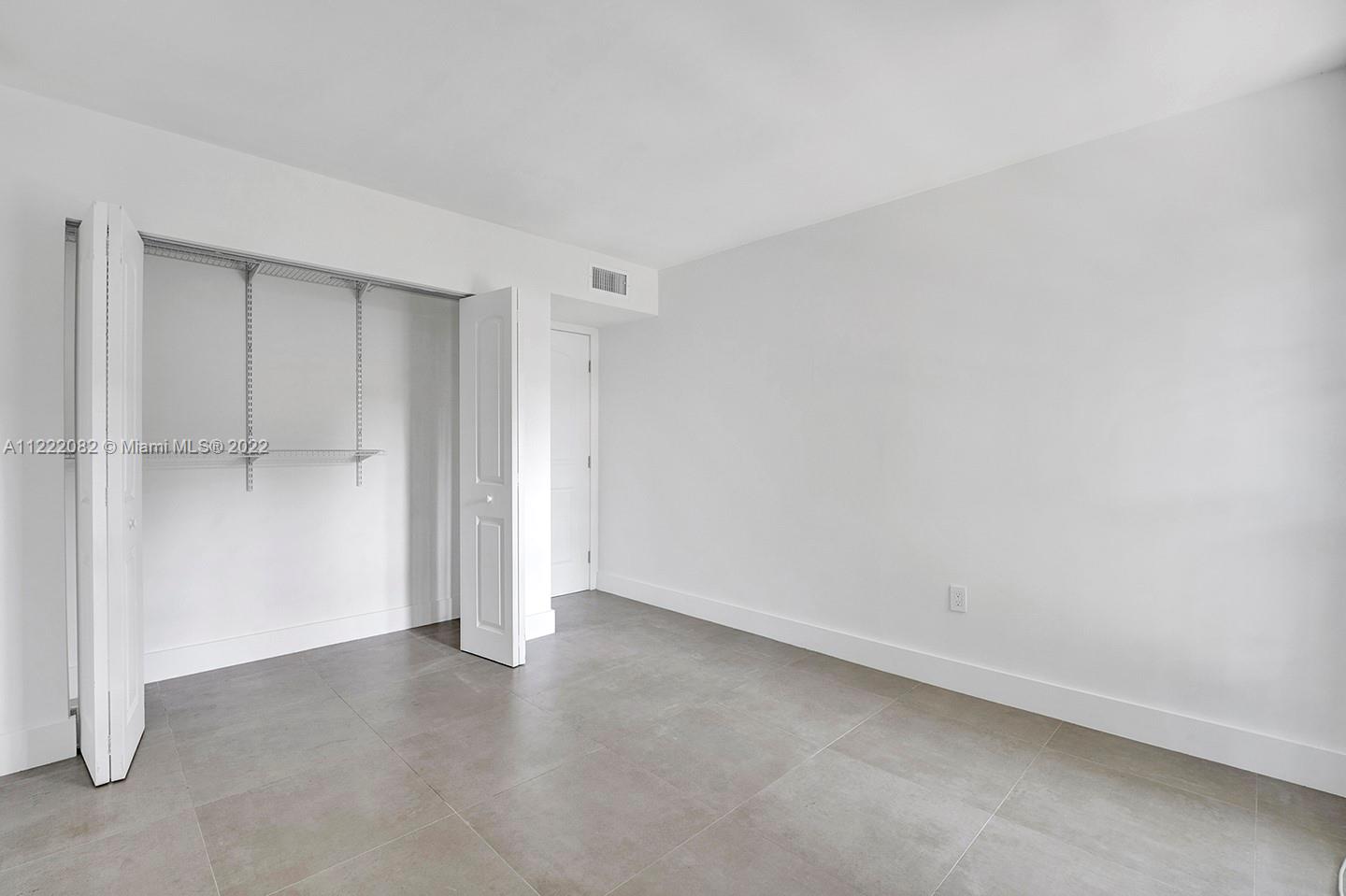 6904 North Kendall Drive, Unit F102 Pinecrest, FL 33156 - Photo 14 of 19 a view of an empty room