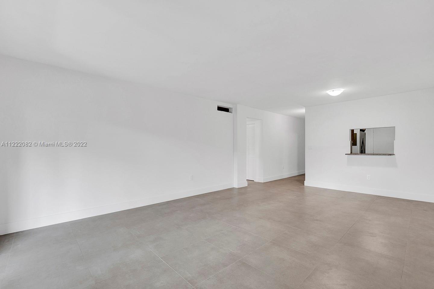 6904 North Kendall Drive, Unit F102 Pinecrest, FL 33156 - Photo 2 of 19 a view of an empty room