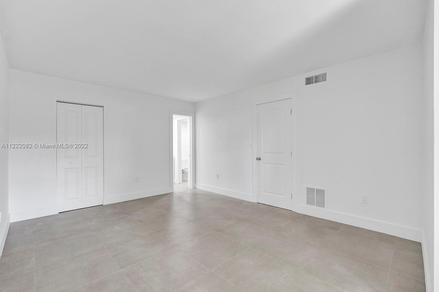 6904 North Kendall Drive, Unit F102 Pinecrest, FL 33156 - Photo 8 of 19 a view of an empty room