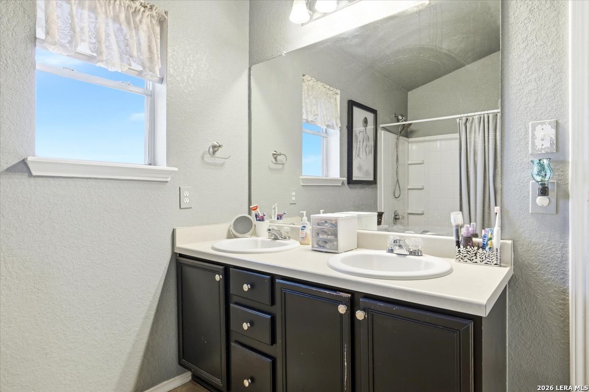 7311 Autumn Ledge Converse, TX 78109 - Photo 15 of 25 a bathroom with a sink and a mirror