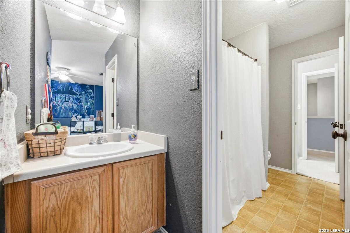 7311 Autumn Ledge Converse, TX 78109 - Photo 19 of 25 a bathroom with a sink double vanity and a mirror