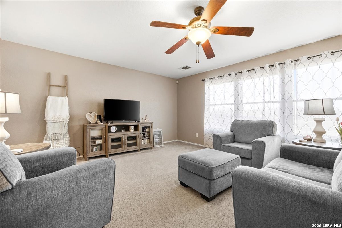 7311 Autumn Ledge Converse, TX 78109 - Photo 5 of 25 a living room with furniture and a flat screen tv