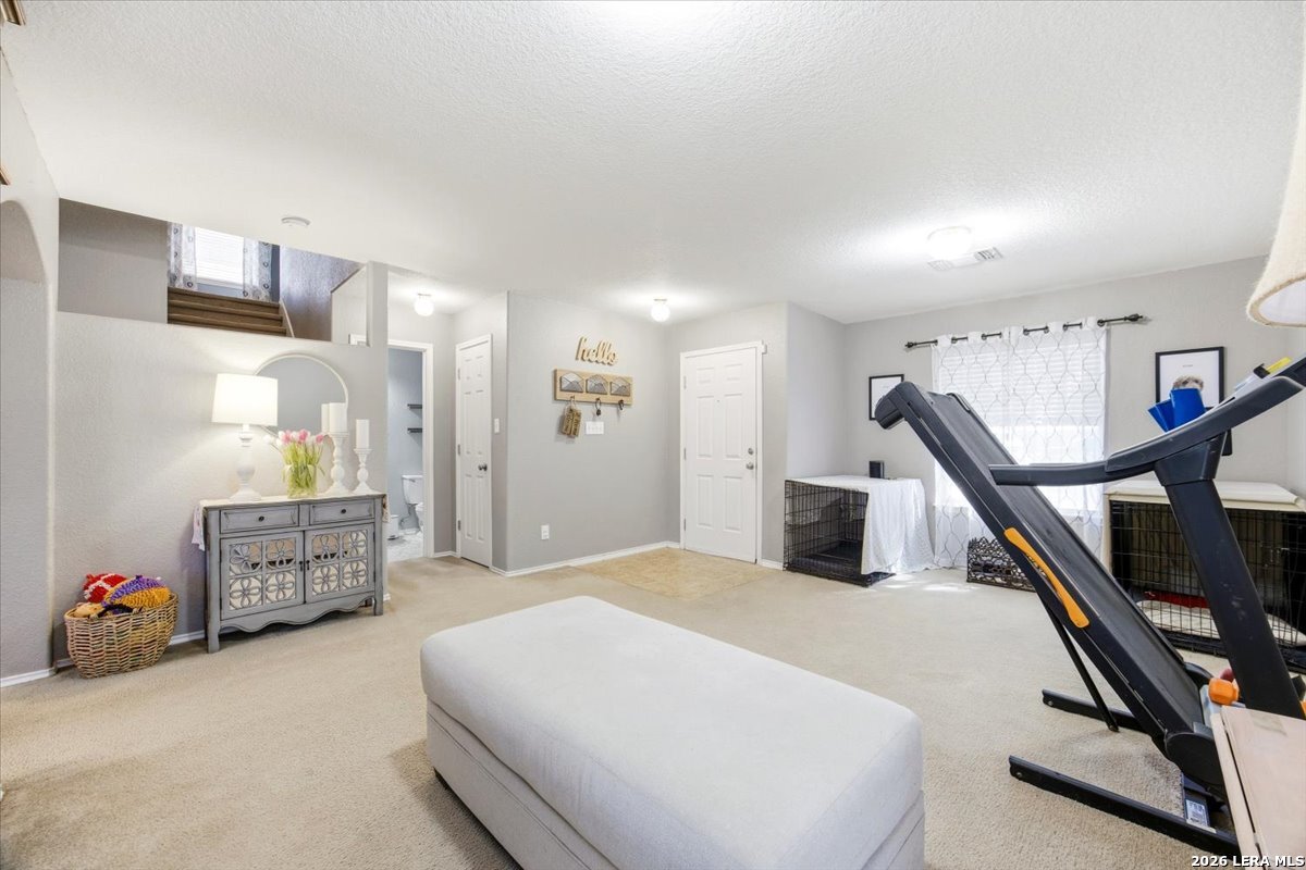 7311 Autumn Ledge Converse, TX 78109 - Photo 7 of 25 a bedroom with furniture and a large window