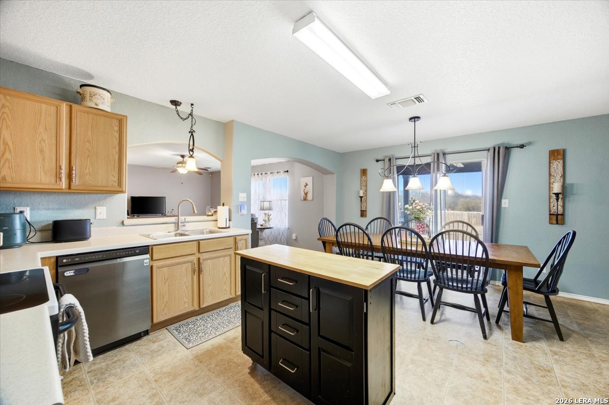 7311 Autumn Ledge Converse, TX 78109 - Photo 8 of 25 a large kitchen with a table and chairs in it