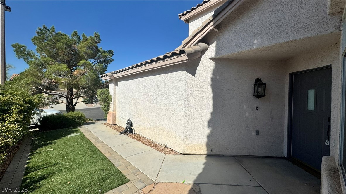 9716 Ridge Creek Place Las Vegas, NV 89134 - Photo 2 of 28 Welcome home to this charming residence featuring a classic tile roof and inviting entryway.