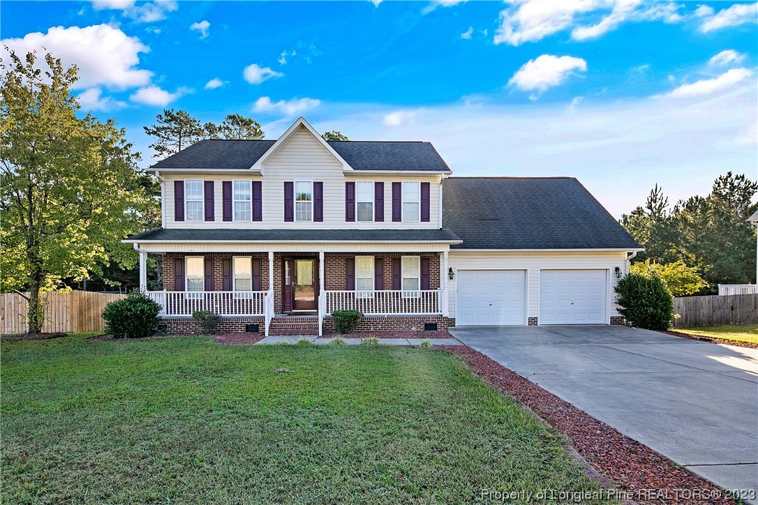 136 Linden Road Cameron, NC 28326 - Photo 1 of 48 a front view of a house with a yard table and chairs