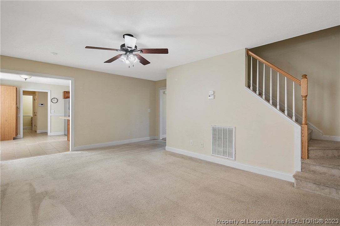 136 Linden Road Cameron, NC 28326 - Photo 11 of 48 a view of an empty room with a ceiling fan