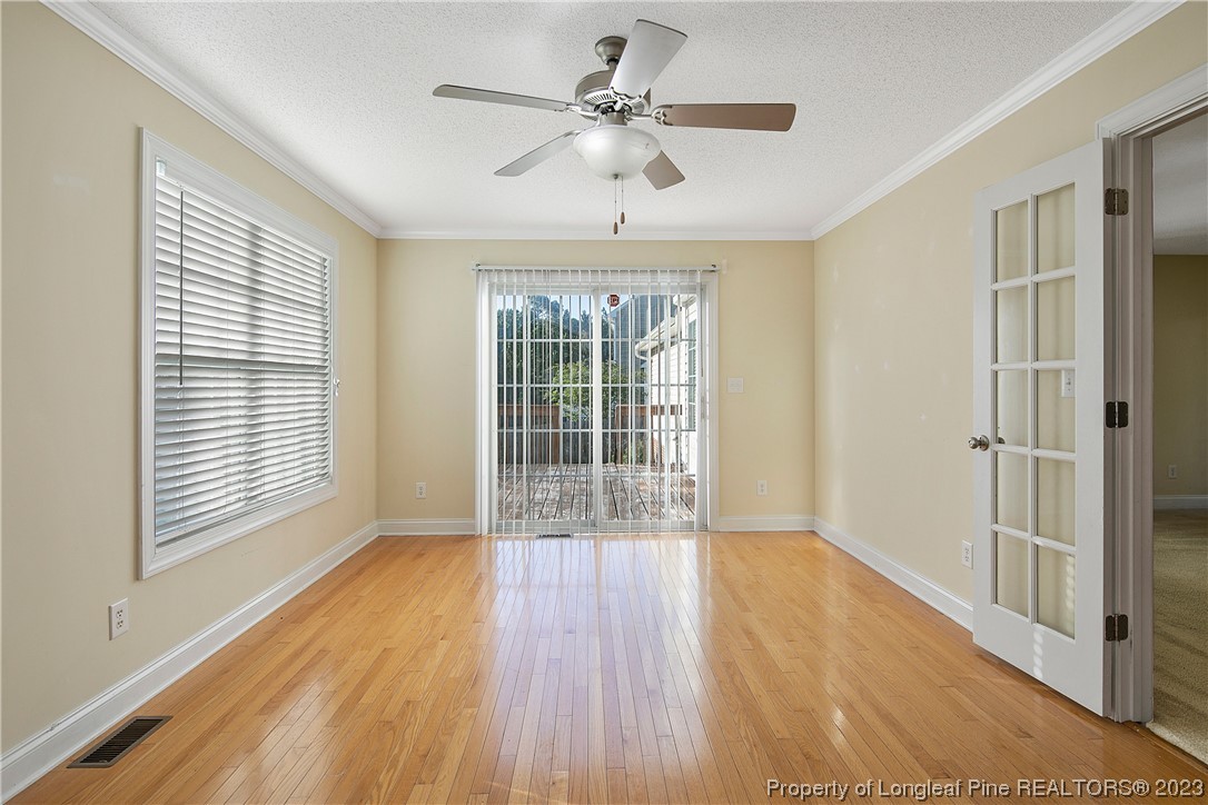 136 Linden Road Cameron, NC 28326 - Photo 13 of 48 a view of an empty room with wooden floor and a window