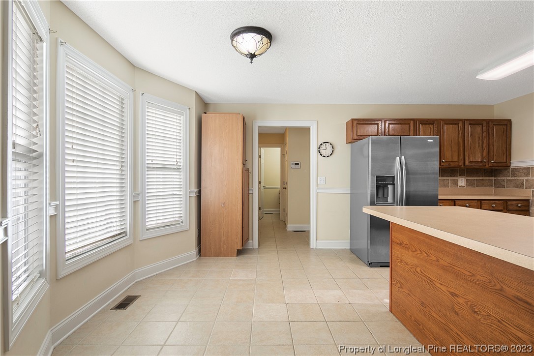 136 Linden Road Cameron, NC 28326 - Photo 15 of 48 a view of a kitchen with a sink and a refrigerator