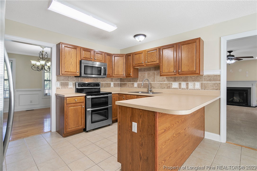 136 Linden Road Cameron, NC 28326 - Photo 17 of 48 a kitchen with a sink stove and refrigerator
