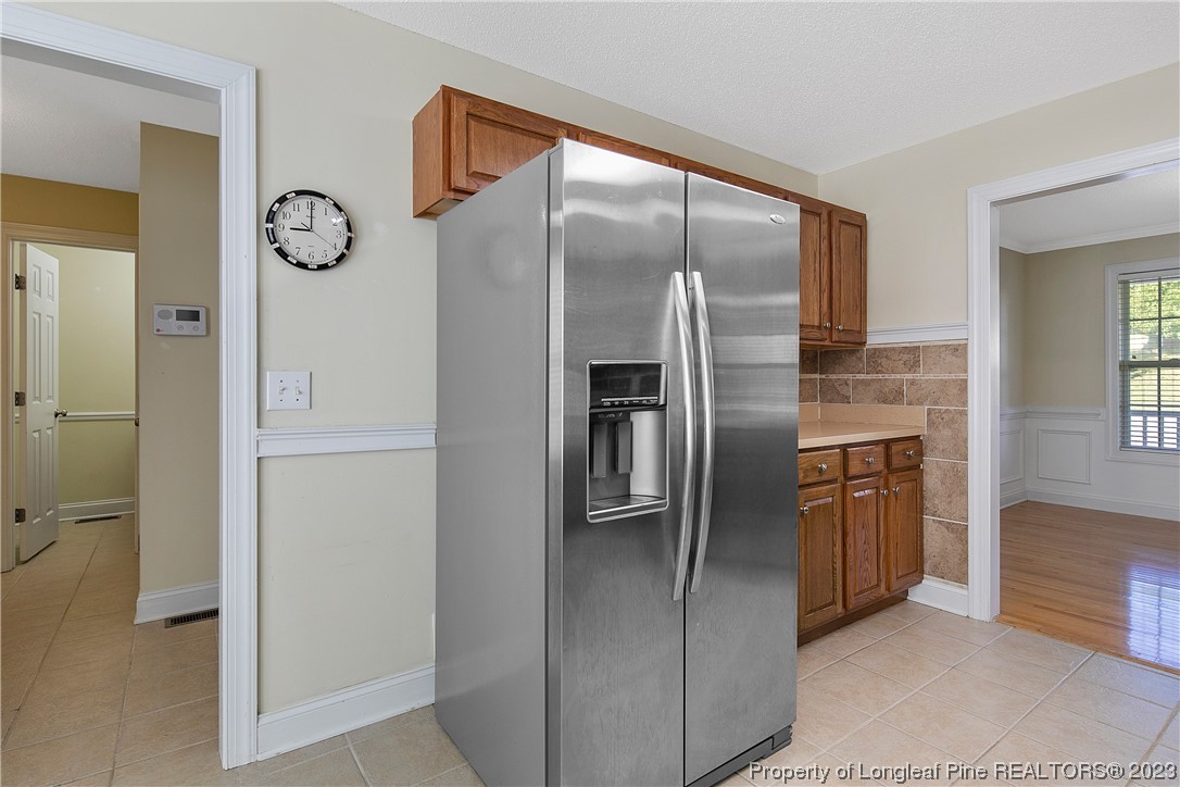 136 Linden Road Cameron, NC 28326 - Photo 18 of 48 a kitchen with stainless steel appliances granite countertop a refrigerator and a sink