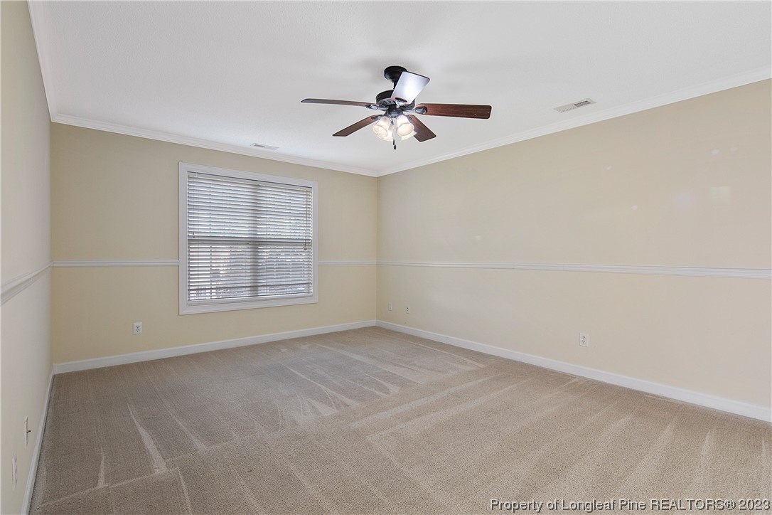 136 Linden Road Cameron, NC 28326 - Photo 26 of 48 an empty room with windows and fan