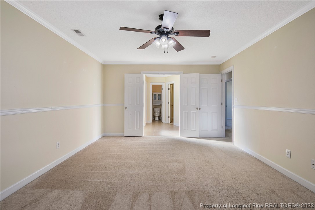136 Linden Road Cameron, NC 28326 - Photo 27 of 48 a view of an empty room with a ceiling fan