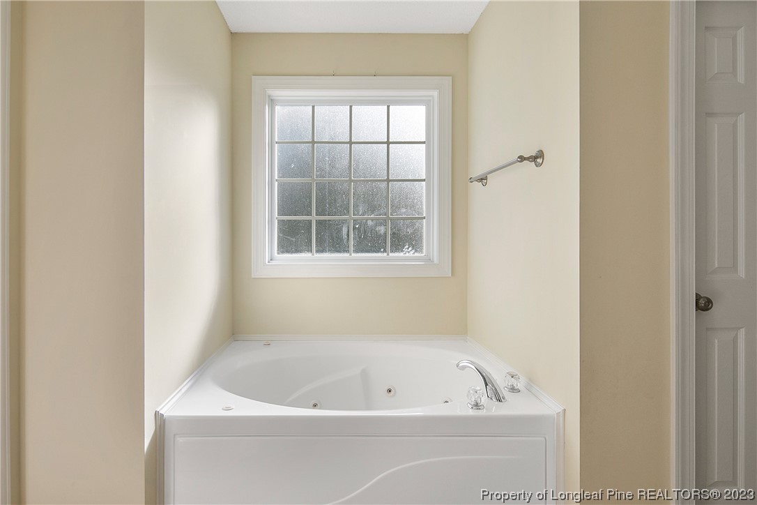 136 Linden Road Cameron, NC 28326 - Photo 32 of 48 a white bath tub sitting next to a window