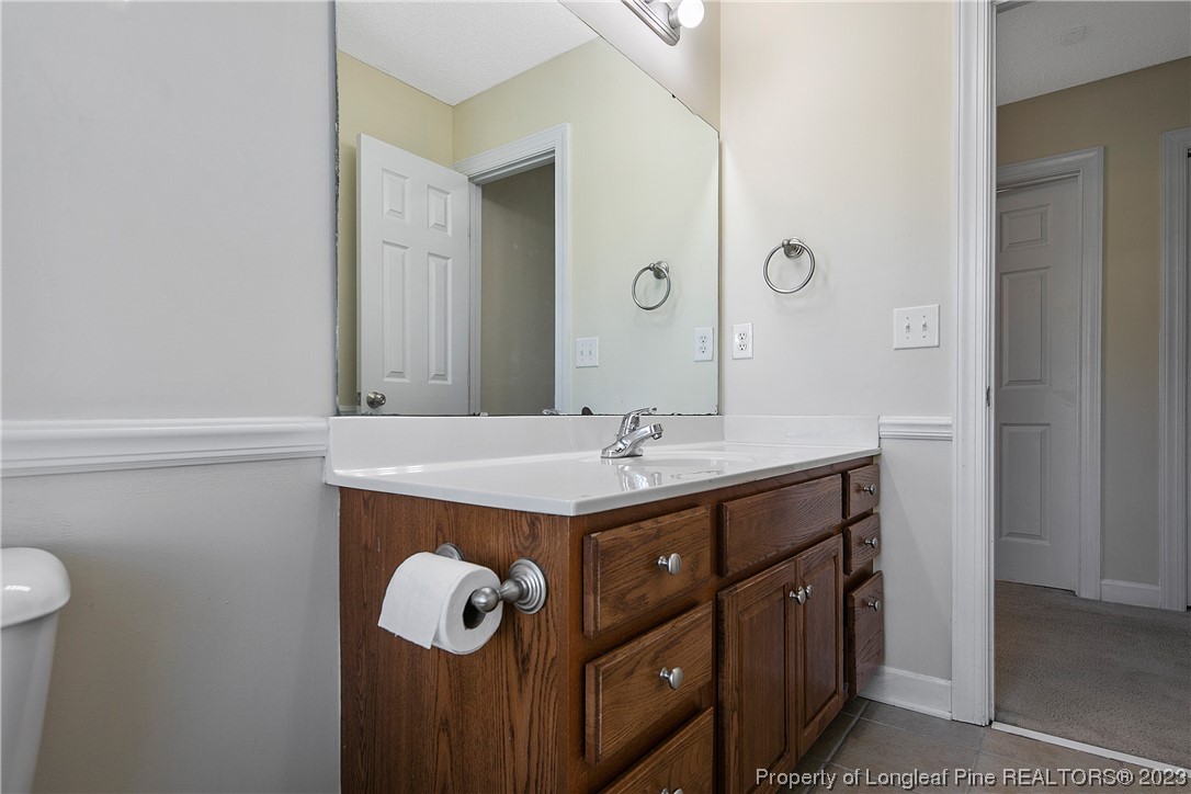 136 Linden Road Cameron, NC 28326 - Photo 38 of 48 a bathroom with a sink vanity and a mirror