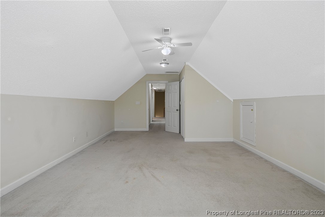 136 Linden Road Cameron, NC 28326 - Photo 44 of 48 a view of an empty room with a ceiling fan