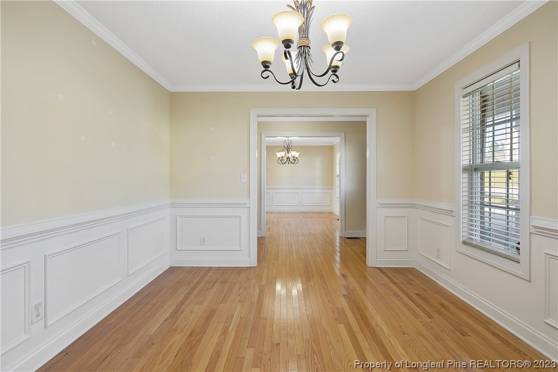 136 Linden Road Cameron, NC 28326 - Photo 6 of 48 a view of empty room with wooden floor and fan