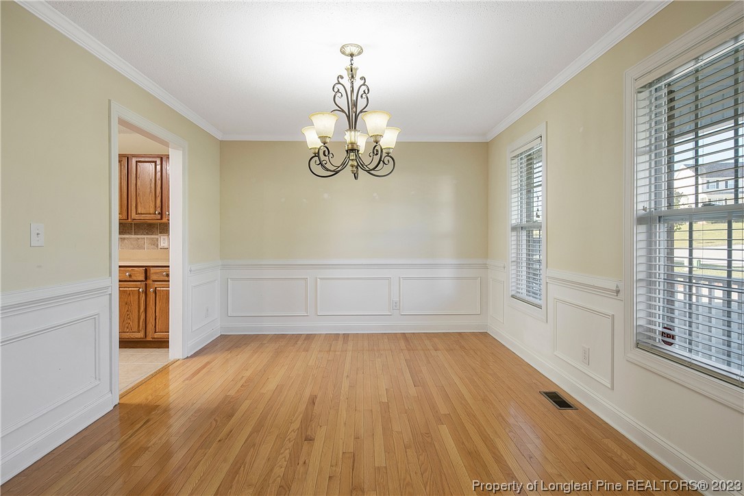 136 Linden Road Cameron, NC 28326 - Photo 7 of 48 a view of wooden floor and windows in a room