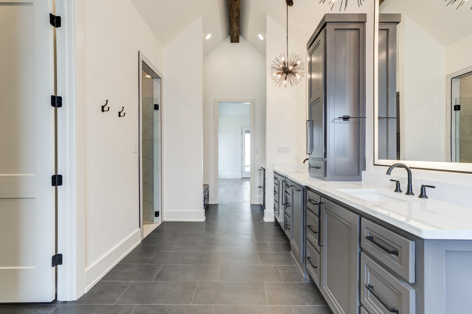 7710 46th Street Lubbock, TX 79407 - Photo 44 of 79 a spacious bathroom with a double vanity sink a mirror and a shower
