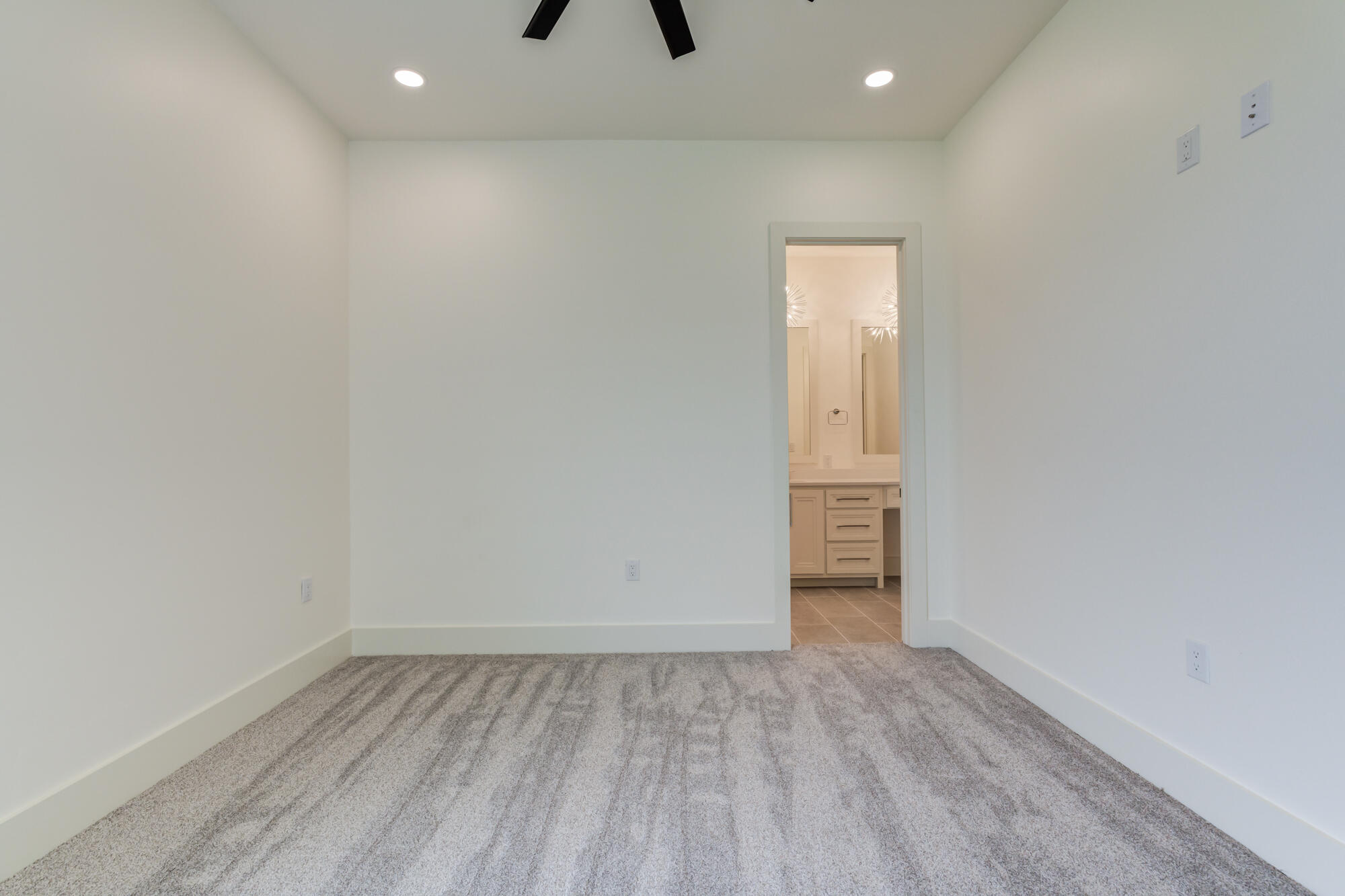 7710 46th Street Lubbock, TX 79407 - Photo 49 of 79 a view of empty room with wooden floor and window