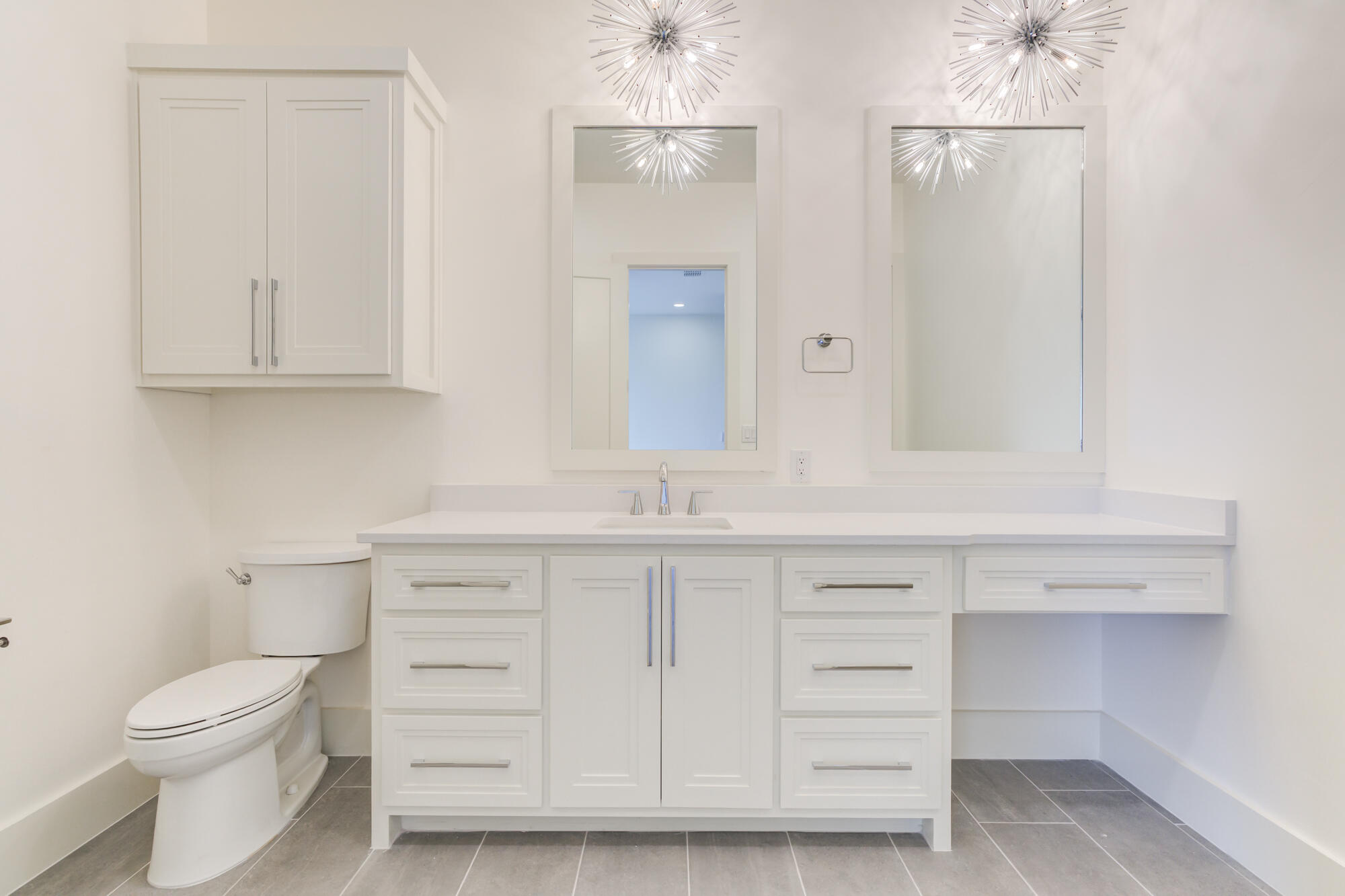7710 46th Street Lubbock, TX 79407 - Photo 50 of 79 a bathroom with a sink a toilet and a mirror