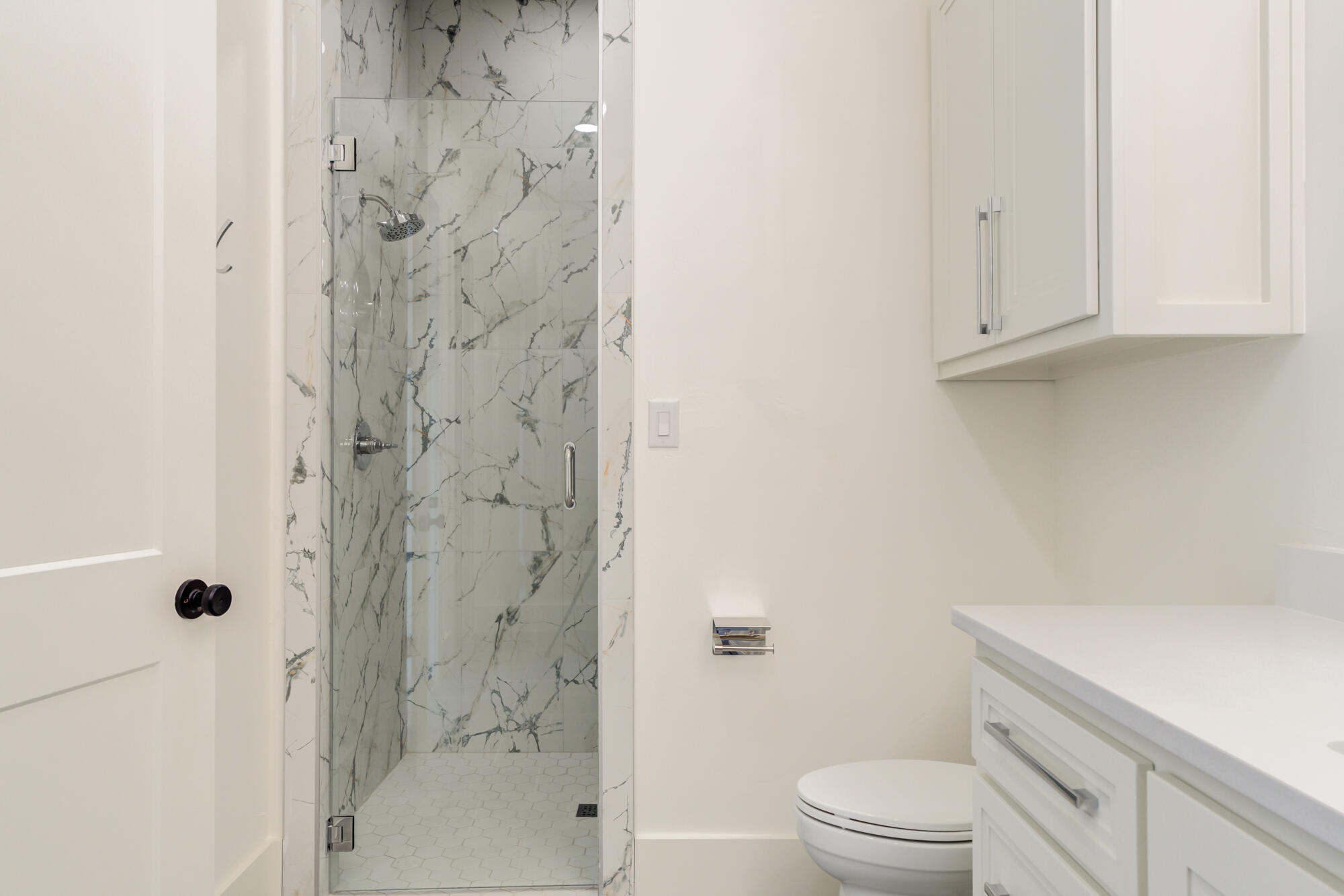 7710 46th Street Lubbock, TX 79407 - Photo 51 of 79 a bathroom with a shower a toilet and a sink