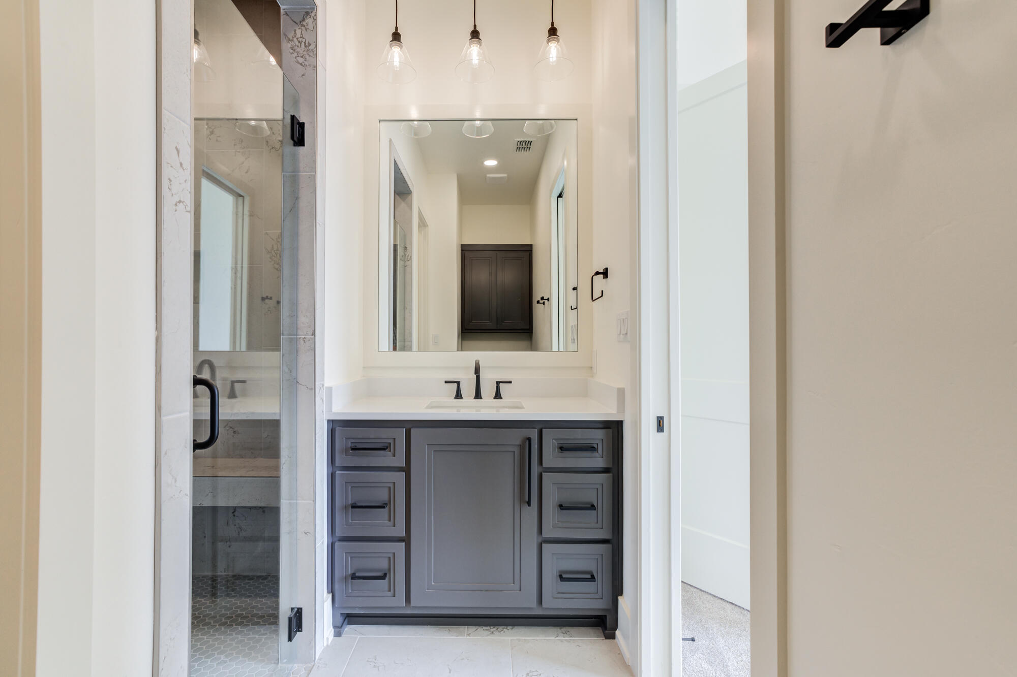 7710 46th Street Lubbock, TX 79407 - Photo 56 of 79 a bathroom with a double vanity sink mirror and shower