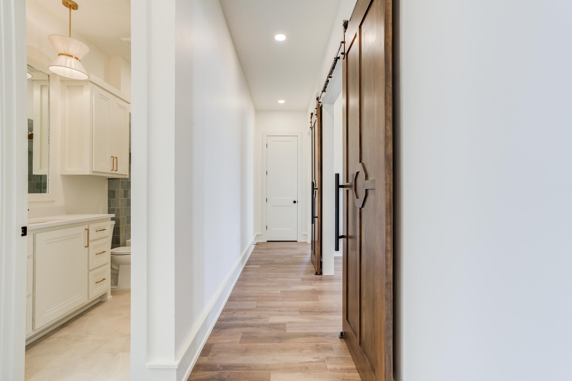 7710 46th Street Lubbock, TX 79407 - Photo 59 of 79 a view of a hallway with wooden floor and staircase