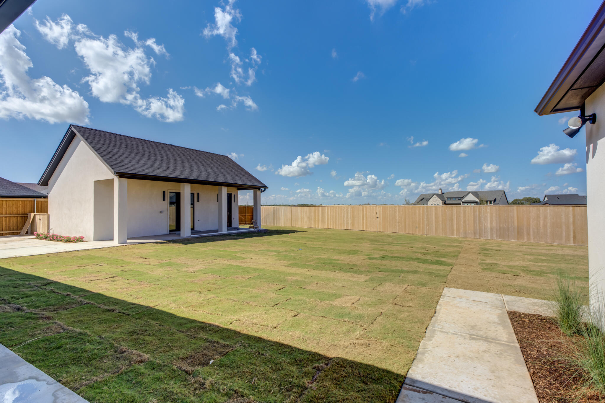 7710 46th Street Lubbock, TX 79407 - Photo 66 of 79 a swimming pool with outdoor seating and yard