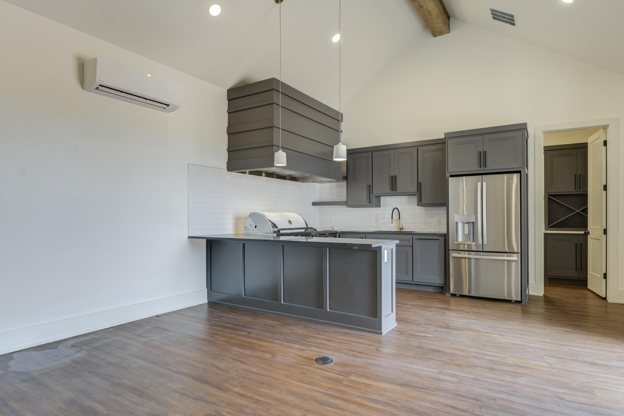 7710 46th Street Lubbock, TX 79407 - Photo 74 of 79 a kitchen with granite countertop a refrigerator and a stove top oven