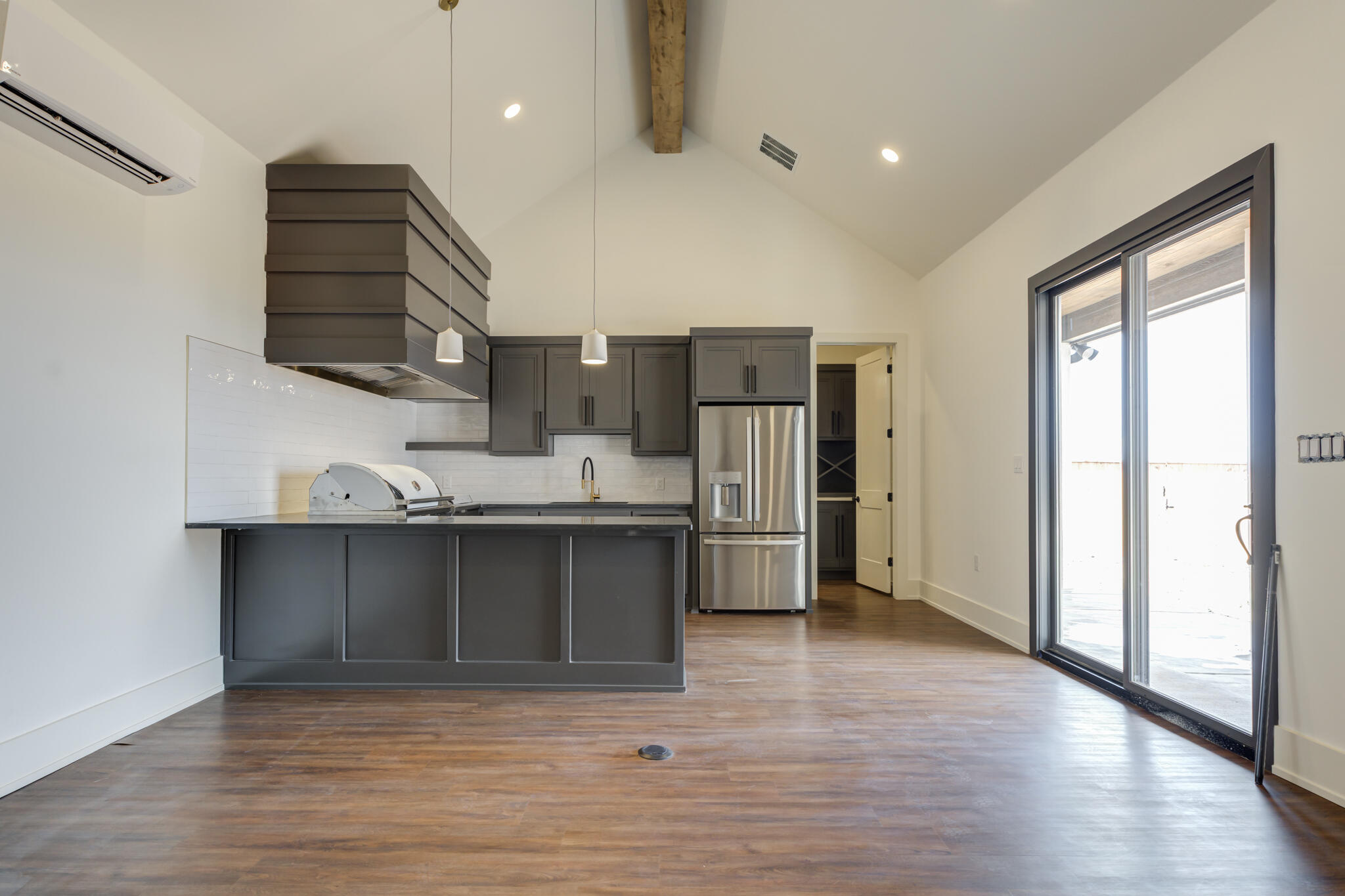 7710 46th Street Lubbock, TX 79407 - Photo 75 of 79 a kitchen with stainless steel appliances a refrigerator and a sink