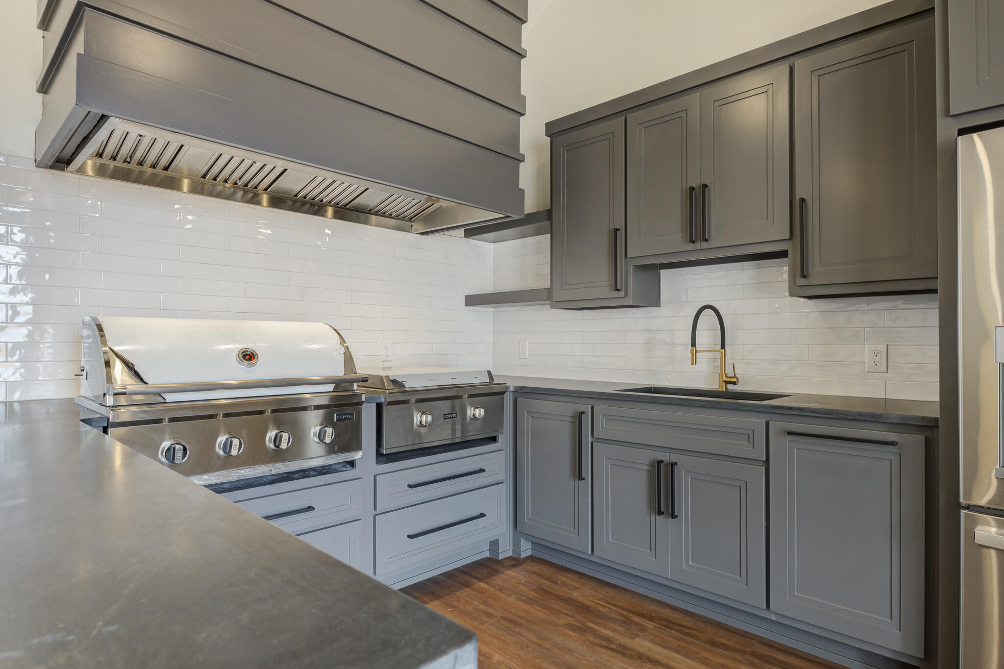 7710 46th Street Lubbock, TX 79407 - Photo 77 of 79 a kitchen with stainless steel appliances granite countertop a sink a stove and cabinets