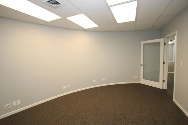an empty room with a empty space and a window