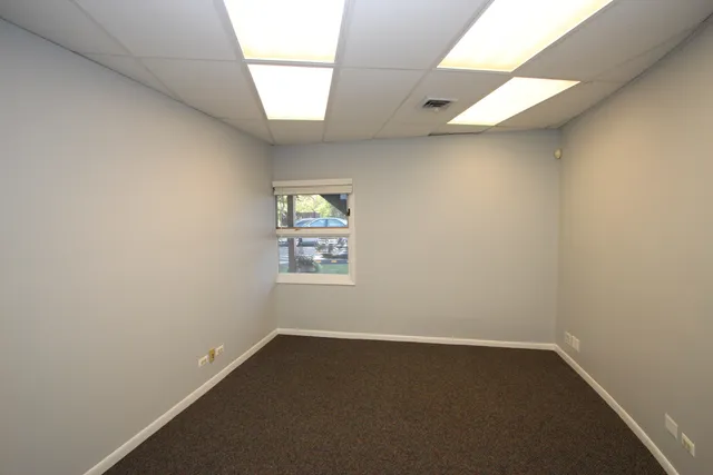 a view of a kitchen with a sink and a window