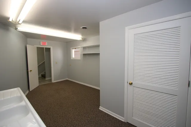 a bathroom with a sink a vanity and a mirror
