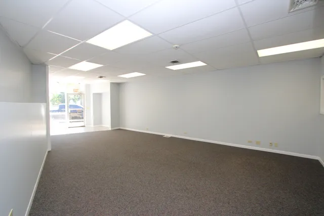 an empty room with an empty space and a window