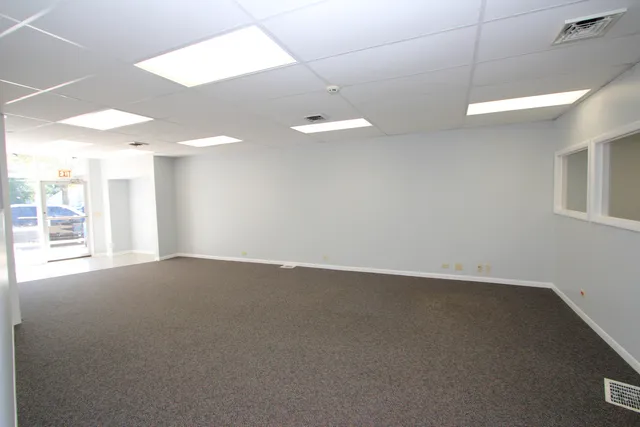a view of a hallway with chandelier