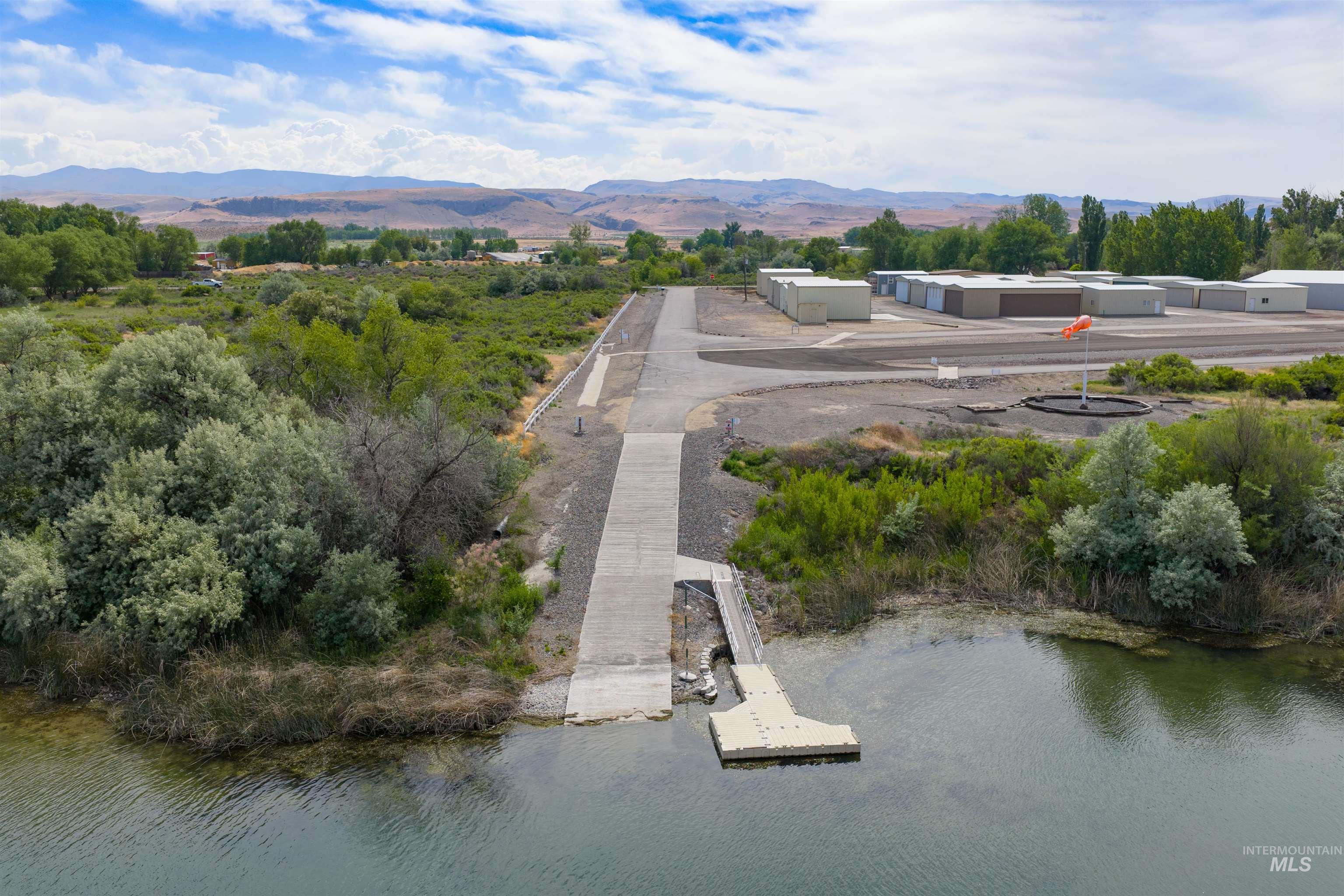 10514 Airpark Loop Road Melba, ID 83641 - Photo 41 of 47 Concrete boat ramp extending to a floating dock