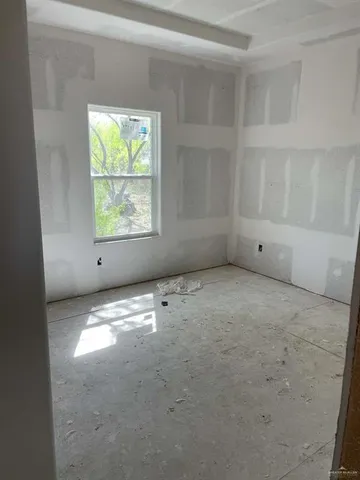 a bathroom with a granite countertop sink a mirror and a shower