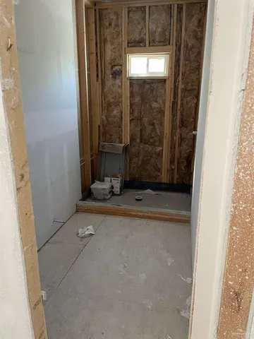 an empty room with mirror