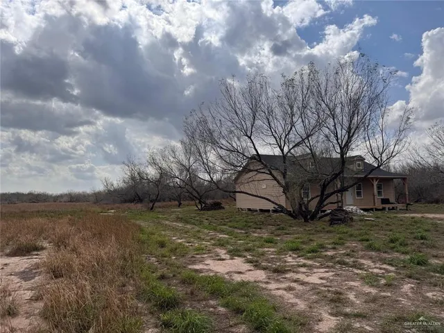 a view of a yard with an trees