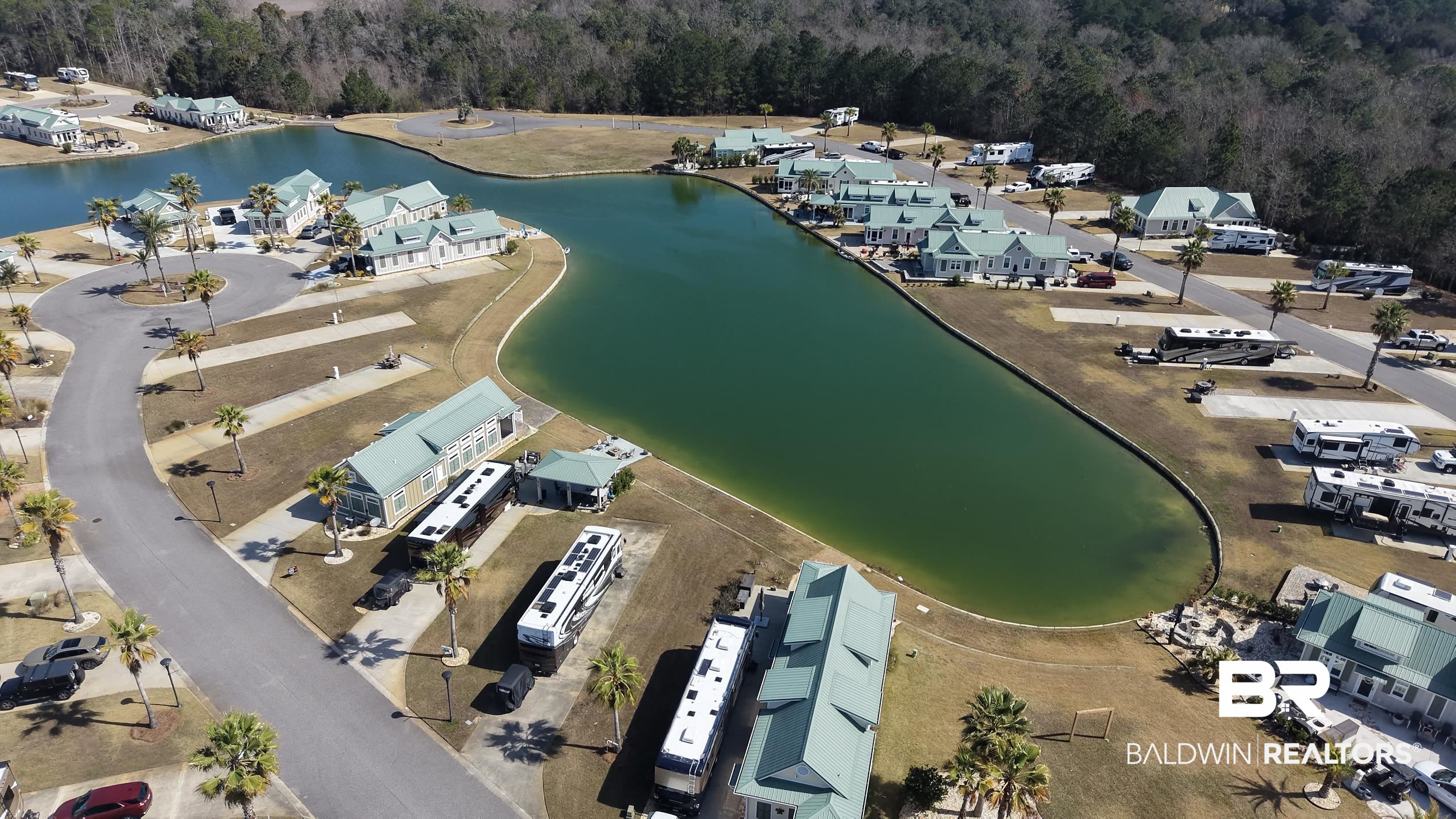 11996 Raptor Court Elberta, AL 36530 - Photo 23 of 45 Aerial view of property's location featuring a large body of water and nearby suburban area