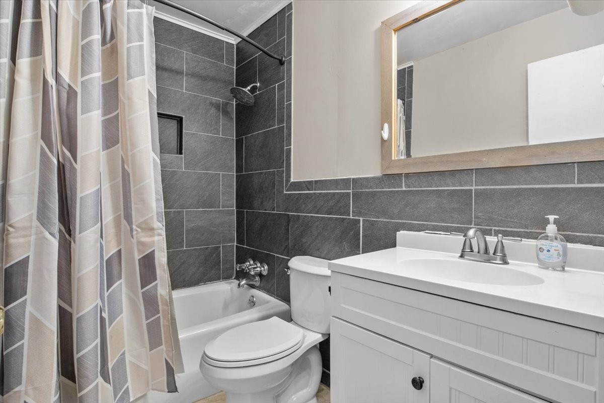 105 Mae Circle Dickson, TN 37055 - Photo 12 of 26 a bathroom with a sink toilet and shower