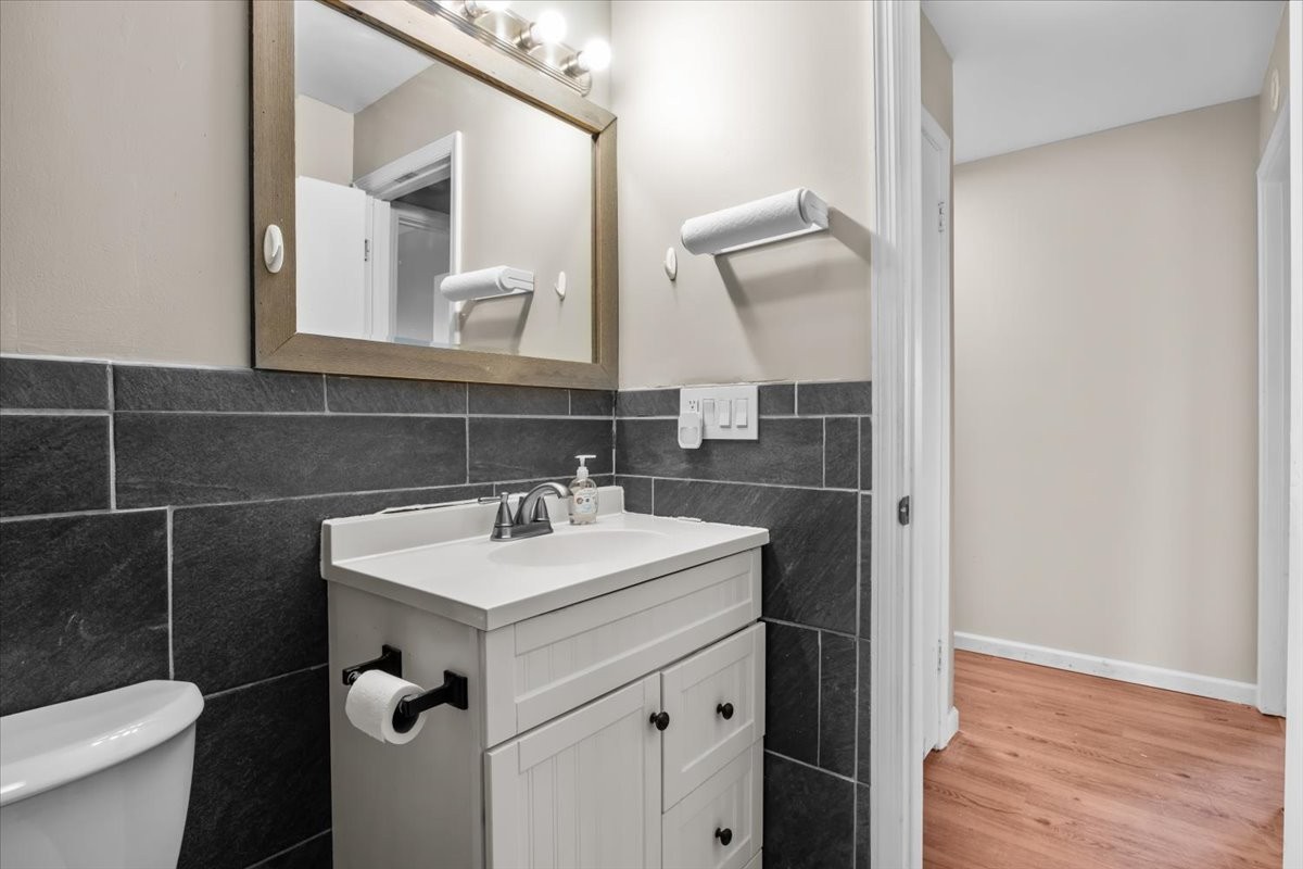 105 Mae Circle Dickson, TN 37055 - Photo 13 of 26 a bathroom with a sink toilet and mirror