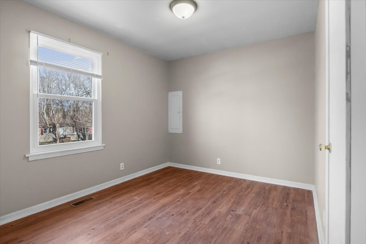 105 Mae Circle Dickson, TN 37055 - Photo 14 of 26 an empty room with wooden floor and windows
