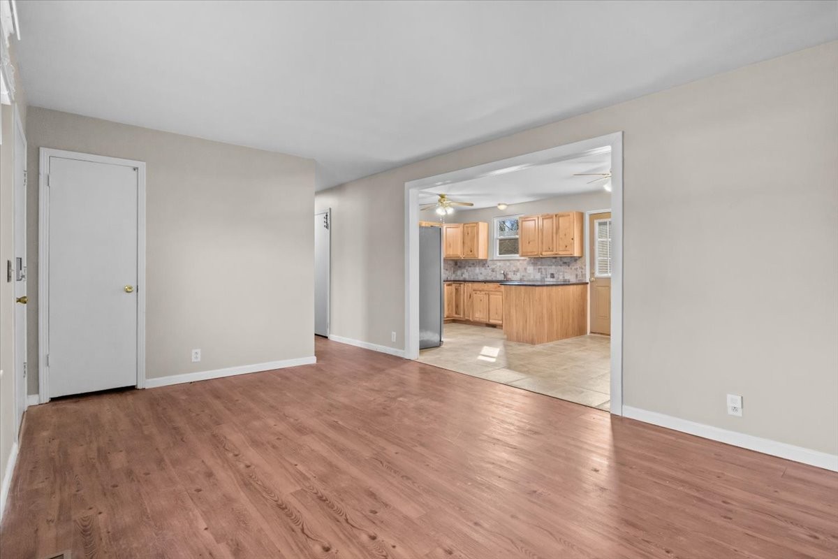 105 Mae Circle Dickson, TN 37055 - Photo 3 of 26 wooden floor in an empty room with a window