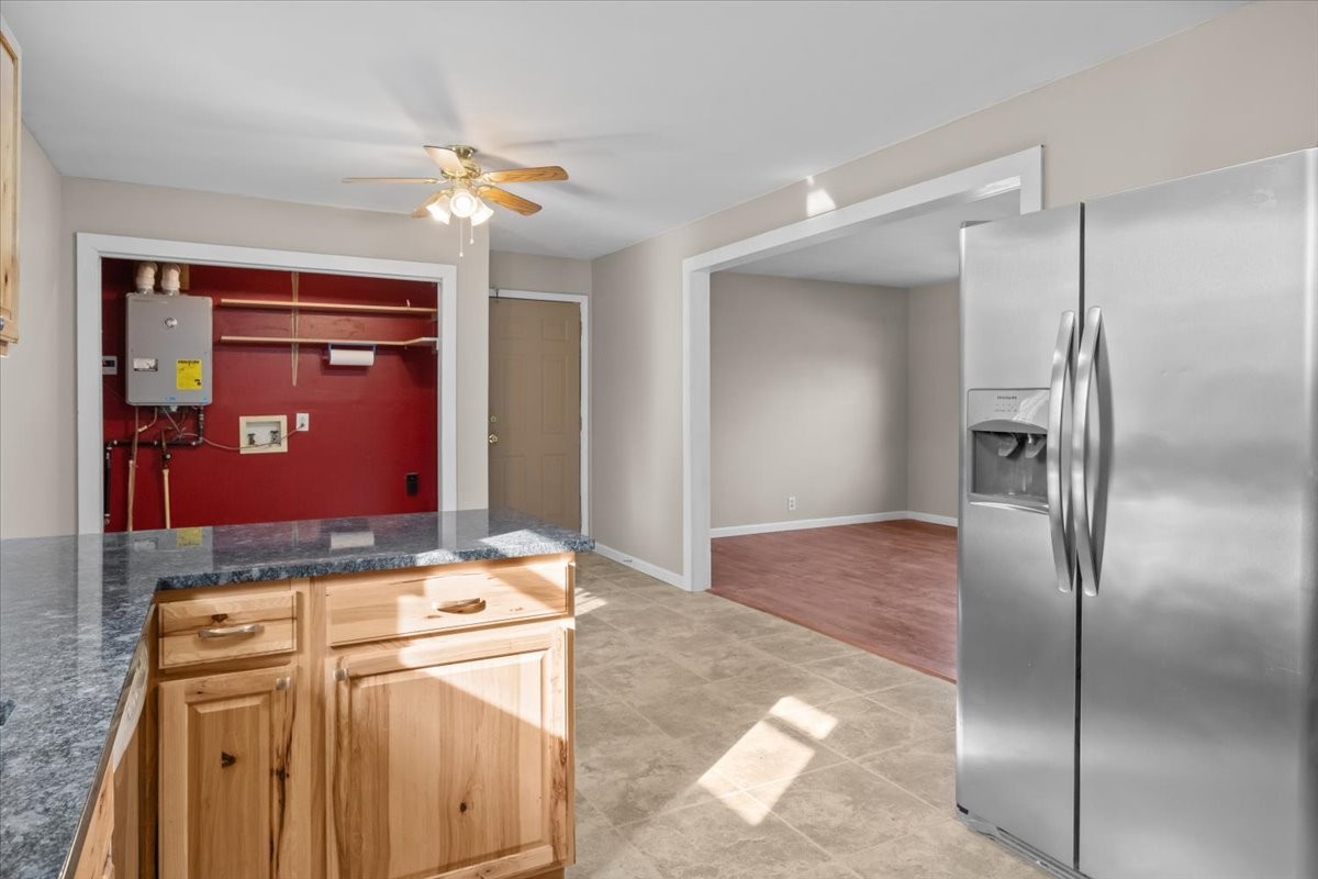 105 Mae Circle Dickson, TN 37055 - Photo 8 of 26 a kitchen with stainless steel appliances granite countertop a refrigerator and a stove top oven