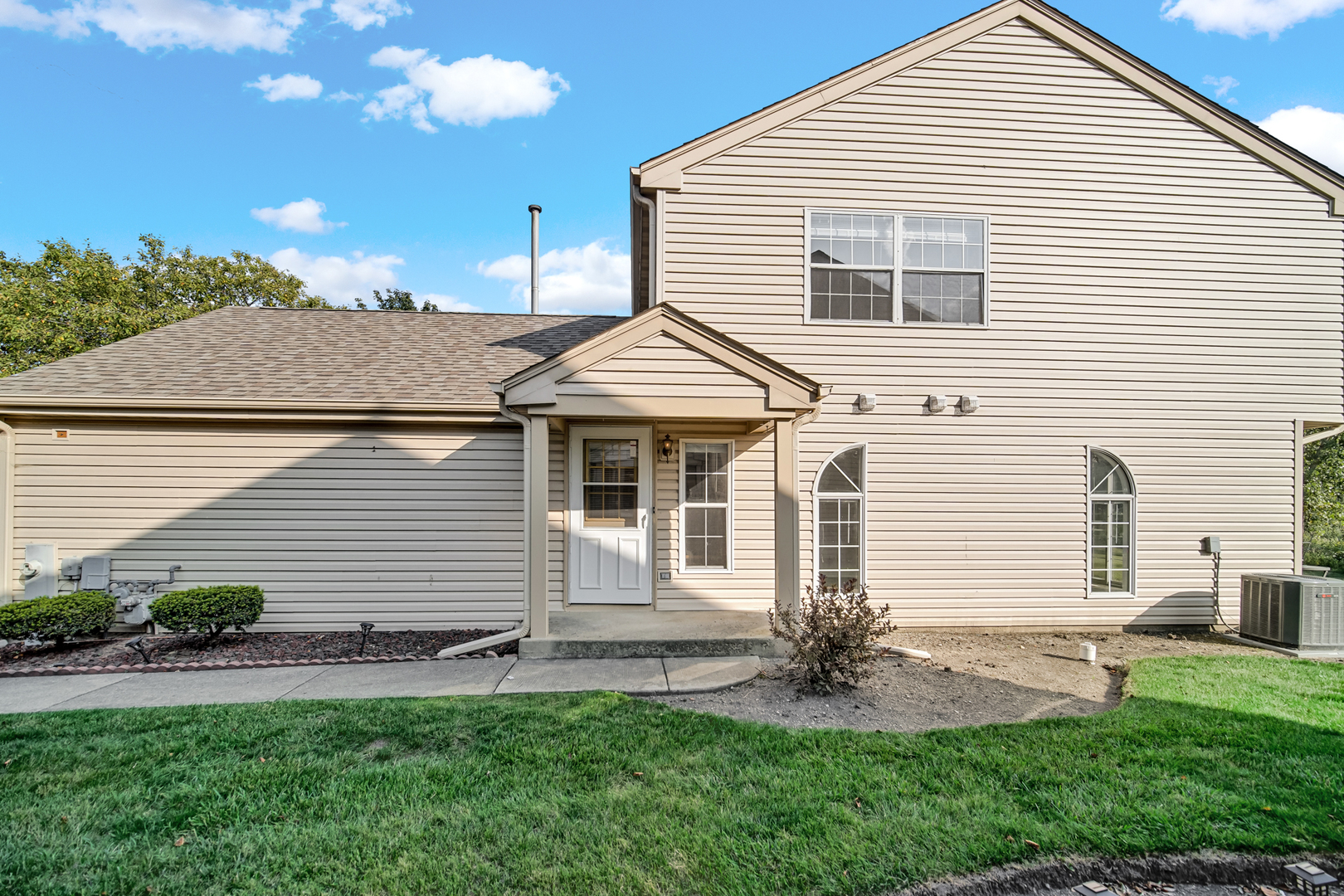 55 King Drive Streamwood, IL 60107 - Photo 17 of 18 a front view of a house with a yard