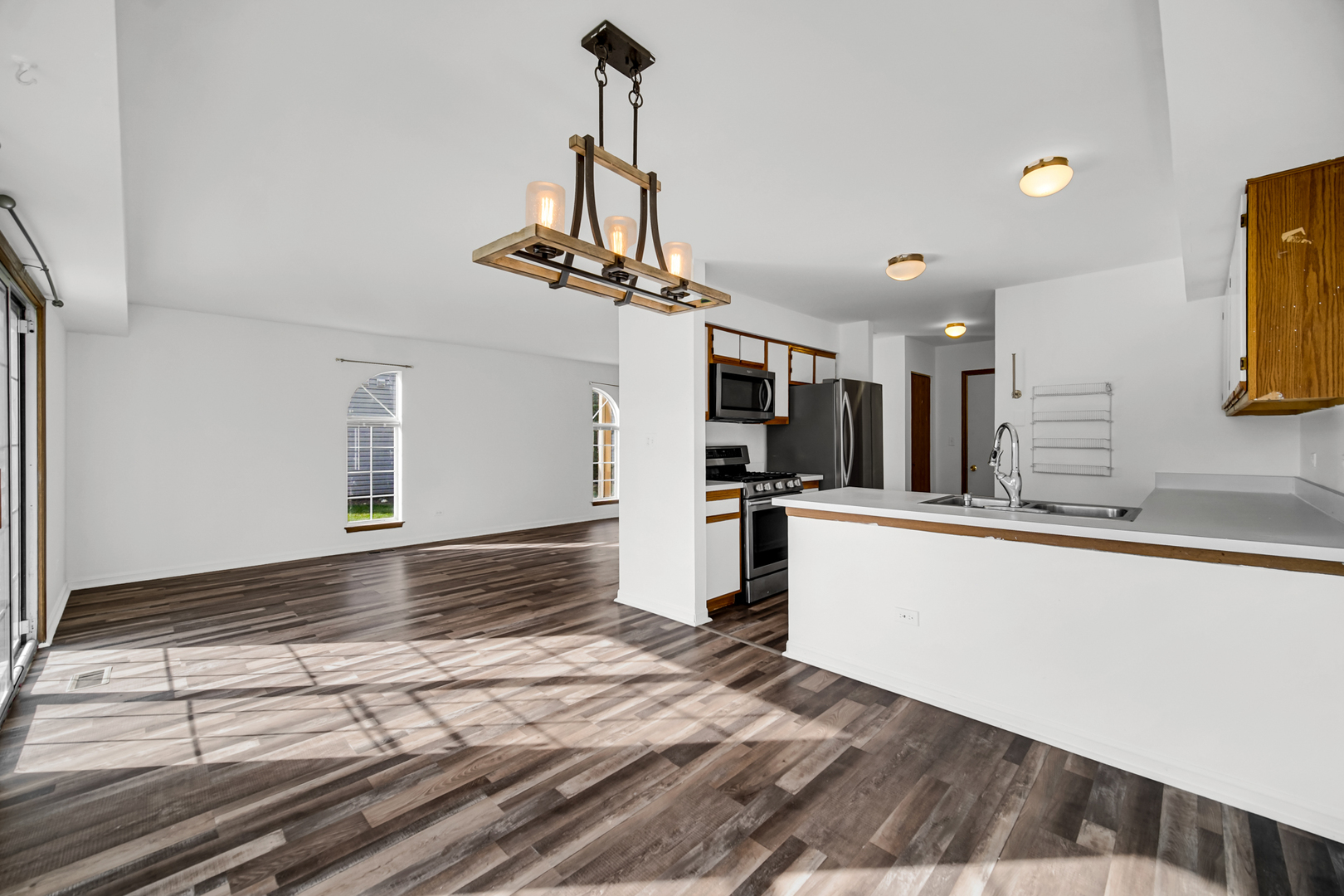 55 King Drive Streamwood, IL 60107 - Photo 5 of 18 a view of a kitchen with a sink and microwave